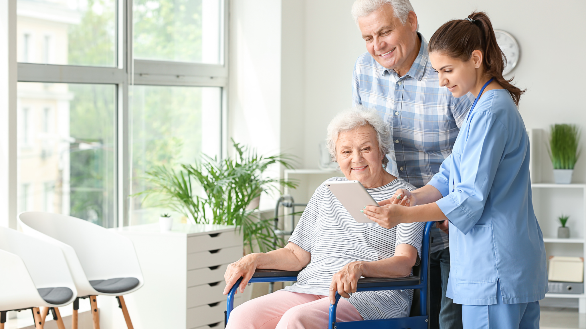 caregiver showing elderly technology