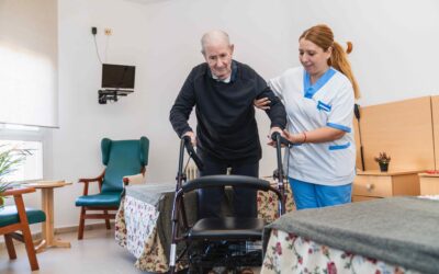 caring-nurse-assisting-elderly-man-with-walker-2025-03-08-21-09-46-utc-min-1-scaled.jpg